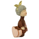 Donna resina con borsa portafiori marrone cm17x13h35